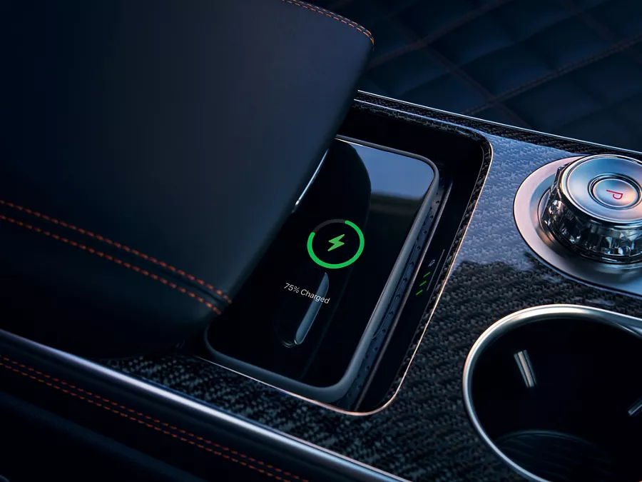 2026 Genesis GV70 center console with wireless smartphone charging and premium controls
