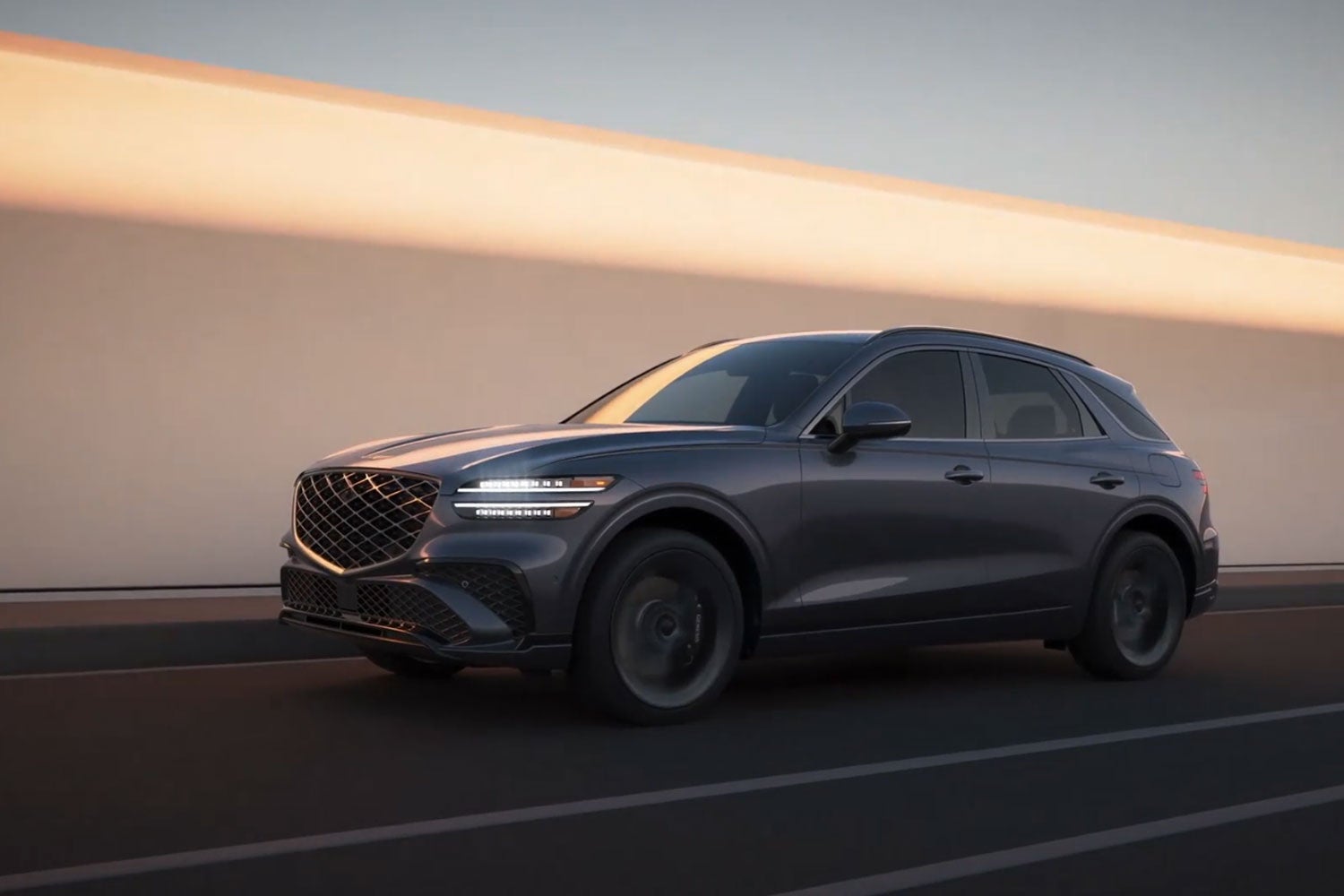 2026 Genesis GV70 luxury SUV driving on the road with sleek exterior styling