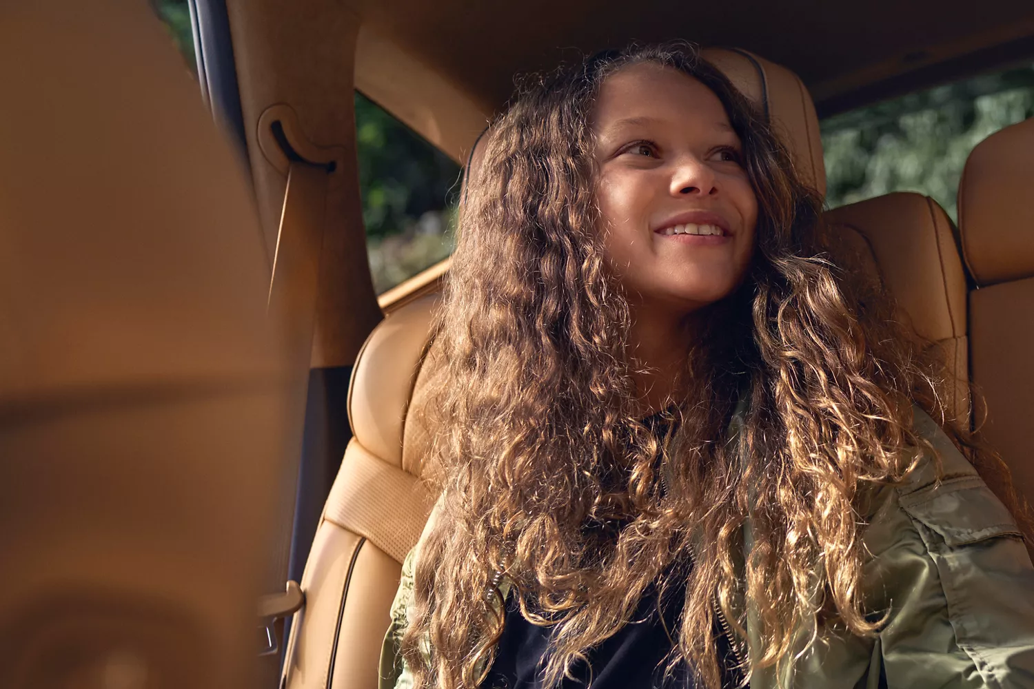 Passenger enjoying spacious rear seating inside the 2026 Genesis GV70 luxury SUV