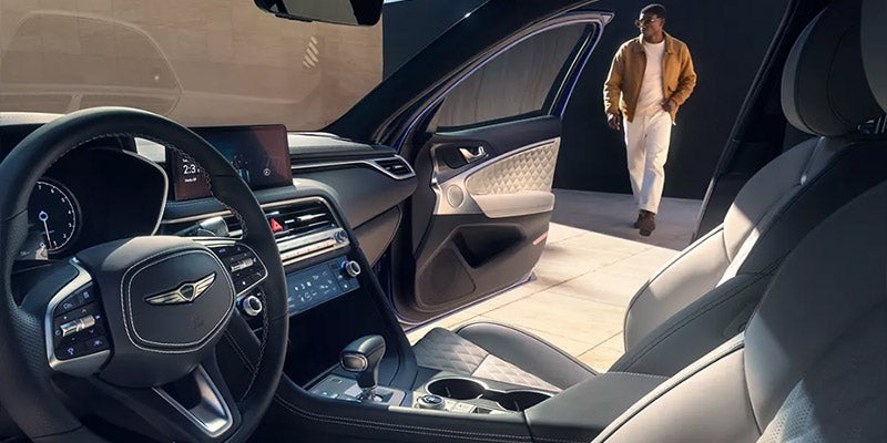 Interior view of Genesis G70 with driver approaching