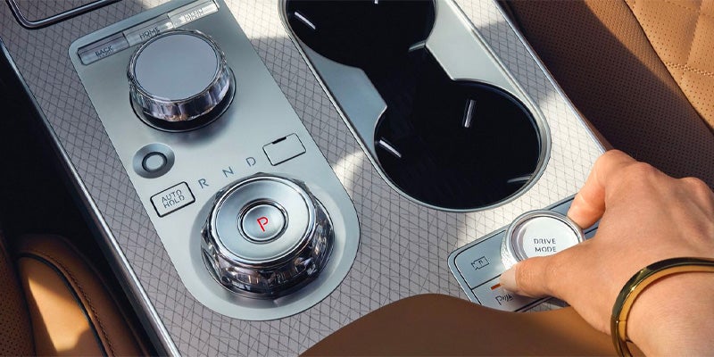 A close-up of the car's center console with the gear shift dial.