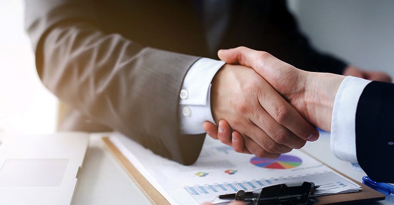 Customer sealing the deal with a handshake